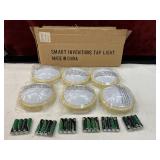 12pc. small, battery-operated LED puck lights
