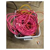 Tote full of extension cords different sizes and