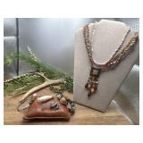 bohemian-style beaded necklace features a square