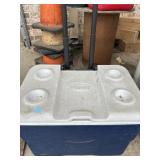 Blue and  white Coleman Xtreme 5 Wheeled Cooler.