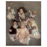 Tote full of porcelain dolls large ones