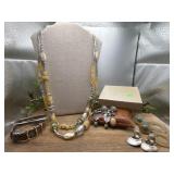 A double strand yellow colored necklace with 3
