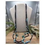 Double-strand black and turquiose necklace.