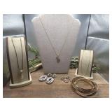 3 gold toned necklaces and 2 pairs of dangle