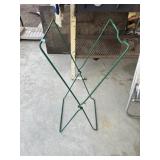 Folding green X-frame bin holder.