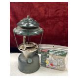 Vintage green Coleman lantern And filter funnel