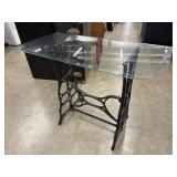 Glass top half table with rustic rivet iron base.