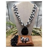 Erica Lyons three-strand necklace features
