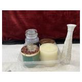 Bundle of candles and white skinny vase .