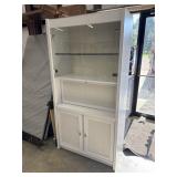 White, tall accent cabinet with glass display