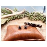 A pair of sterling silver heart earrings studded