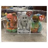 3 beanie babies in there protective case