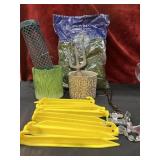 Bundle of outdoor gardening and camping items.
