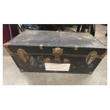 Vintage Seward black steamer trunk.
