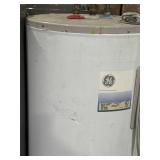 Pallet of three water heaters. Performance Rheem.