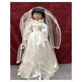 Vintage porcelain bride doll in Satin gown.