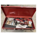 Red metal toolbox with contents.
