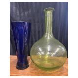 Vintage green demijohn and cobalt blue vase.