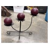 Dark metal candelabra with 3 round candles.