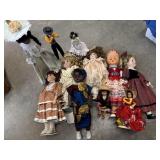 Tote full of porcelain dolls and other dolls
