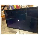 Apple iMac all-in-one desktop with key board.