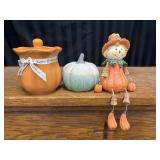 Fall Decor Scarecrow and pumpkins.
