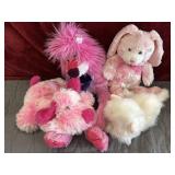 Bundle of pink stuffed animals.