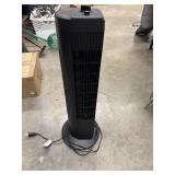 Black tower fan with top-mounted controls.