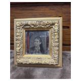Vintage tin type picture housed in an ornate gold