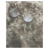 Antique pince-nez eyeglasses featuring a chain