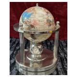 Rotating world globe crafted from gemstones and