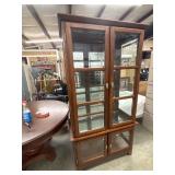 Kevin D Bowling cherry-finish curio cabinet