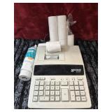 Monroe printing calculator and paper.