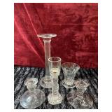Bundle of glass candlestick holders.