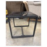 Black metal glass top coffee table.