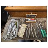 Bundle of tools.  Pliers, sockets and more.