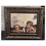 Framed print of Raphaelï¿½s cherubs.