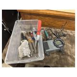 Plastic box full of man items.
