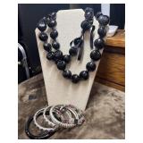 Black kukui nut Lei and bangles.