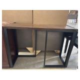 Industrial modern console table features a dark