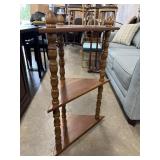Vintage three-tier wooden corner shelf, featuring