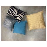 Bundle of decorative throw pillows.