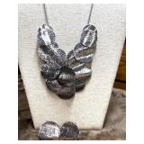 Silver-tone Erica Lyons necklace and earrings.