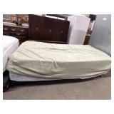 Twin size adjustable bed frame with mattress.