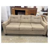 Lonoke Sofa by Ashley features neutral parchment