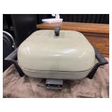 1970s vintage Sunbeam electric skillet with cord.