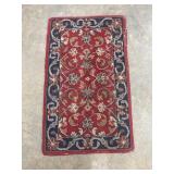 Red and navy blue hand-knotted rug
