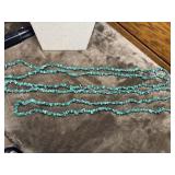 Green stone necklace composed of raw chip beads.