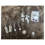 Bundle of dangle earrings.