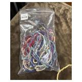 Bundle of multi colored beaded necklaces.